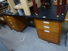 AN EXECUTIVE TEAK DOUBLE PEDESTAL DESK, WITH BLACK LEATHERETTE COVERED TOP, SEVEN DRAWERS, 6? X 3?