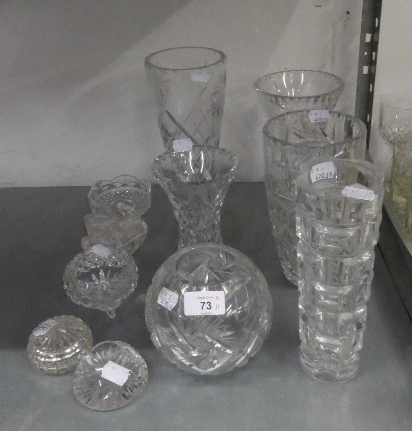 THREE GOOD SIZE CUT GLASS FLOWER VASES, WITH WHORL CUT DECORATION, AN ORBICULAR CUT GLASS VASE,