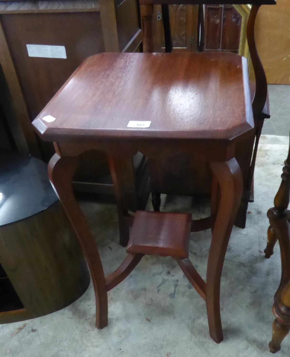 A STAINED OAK OCCASIONAL TABLE WITH SQUARE TOP WITH CANTED CORNERS AND UNDER-TIER