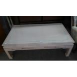 A STYLISH CREAM PAINTED OBLONG COFFEE TABLE, OF CHINESE STYLE WITH PLATE GLASS TOP (L. 121cm x W.