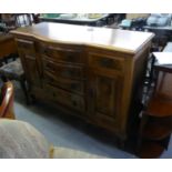 A MAHOGANY AND FIGURED WALNUT SIDEBOARD WITH NEST OF FOUR CENTRE DRAWERS WITH BOW FRONTS, FLANKED BY