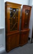 A YEW-WOOD TALL NARROW DISPLAY CABINET, THE UPPER SECTION HAVING ASTRAGAL GLAZED DOOR, ABOVE A PANEL