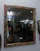 A MODERN RECTANGULAR WALL MIRROR, IN FLORAL FRAME