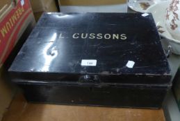 BLACK JAPANNED DEED BOX 'L. CUSSONS' AND A TURNED PINE CURTAIN POLE (2)