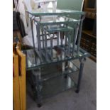 A GREY WROUGHT IRON SIDE TABLE OR TROLLEY, WITH PLATE GLASS TOP AND TWO PLATE GLASS UNDERSHELVES, ON