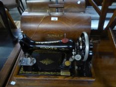 A VINTAGE TABLE TOP SEWING MACHINE, No. 5715764, in a dome case