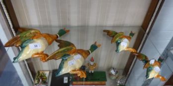 SET OF FOUR BESWICK FLYING DUCKS POTTERY WALL PLAQUES, (596-1 to 4), (4)