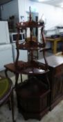 A MAHOGANY CORNER WHAT-NOT WITH FOUR GRADUATED SHELVES AND A SMALL CUPBOARD BASE