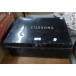 BLACK JAPANNED DEED BOX 'L. CUSSONS' AND A TURNED PINE CURTAIN POLE (2)