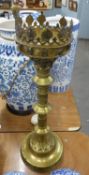 ARTS AND CRAFTS LARGE BRASS CANDLESTICK, THE CIRCULAR PRICKET TOP WITH GALLERY OF RAISED LEAVES,