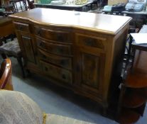 A MAHOGANY AND FIGURED WALNUT SIDEBOARD WITH NEST OF FOUR CENTRE DRAWERS WITH BOW FRONTS, FLANKED BY