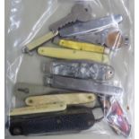 A SMOKER'S STEEL PENKNIFE, TOOLS AND DAMPER COMBINED AND 11 OTHER POCKET KNIVES