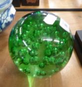 TWENTIETH CENTURY REPRODUCTION BOTTLE GREEN BUBBLE GLASS 'DUMP' DOOR STOP