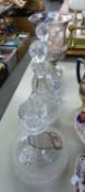 PAIR OF CUT GLASS PEAR SHAPED DECANTERS AND STOPPERS, 12" (30.5cm) HIGH OVERALL; A CUT GLASS