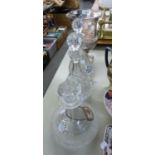 PAIR OF CUT GLASS PEAR SHAPED DECANTERS AND STOPPERS, 12" (30.5cm) HIGH OVERALL; A CUT GLASS