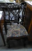 AN ELABORATELY CARVED MAHOGANY SINGLE DRAWING ROOM CHAIR, WITH COVERED FABRIC SEAT