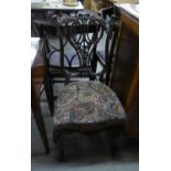 AN ELABORATELY CARVED MAHOGANY SINGLE DRAWING ROOM CHAIR, WITH COVERED FABRIC SEAT