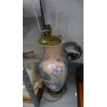 TWO ORIENTAL POTTERY VASE TABLE LAMPS AND SHADES, AND A MURAL BRIGHT METAL FRAMED SHAVING MIRROR, ON