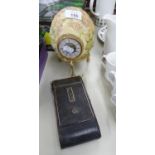 A DECORATED OSTRICH EGG WITH FITTED CLOCK ON STAND AND AN OLD POCKET CAMERA (2)