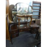 A 1930's KNEEHOLE DRESSING TABLE WITH FRAMELESS TRIPLE DRESSING MIRRORS, ON CABRIOLE LEGS AND A