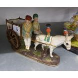 A CONTINENTAL PORCELAIN DONKEY CART WITH TWO RIDERS