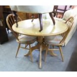 A LIGHT OAK CIRCULAR TRIPOD BREAKFAST TABLE AND A PAIR OF ERCOL  HOOP BACK SINGLE CHAIRS