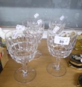 SET OF FIVE CUT GLASS WINE GOBLETS, WITH BLADE AND THUMB CUT BOWLS