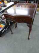 NEAR PAIR OF SMALL MAHOGANY SIDE TABLES, WITH SERPENTINE FRONTS AND SINGLE DRAWER, RAISED ON LONG