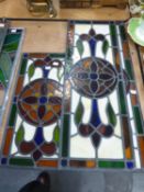 THREE EARLY TWENTIETH CENTURY LEADED AND GLAZED PANELS FOR A DOOR, FLOWERHEAD PATTERN WITH SLIP