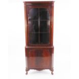 GEORGIAN STYLE MAHOGANY DOUBLE CORNER CUPBOARD, with astragal glazed door over a panel door, on