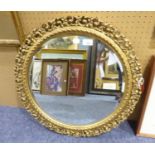 A CIRCULAR BEVELLED EDGE WALL MIRROR