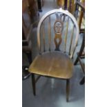 A SET OF FOUR HARDWOOD WINDSOR STICK AND SPLAT HOOP BACKED DINING CHAIRS
