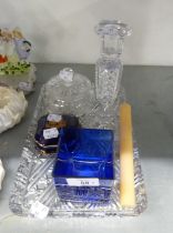 CUT GLASS OBLONG DRESSING TABLE TRAY, CANDLESTICK AND POWDER BOWL WITH COVER AND A BLUE GLASS CUBE