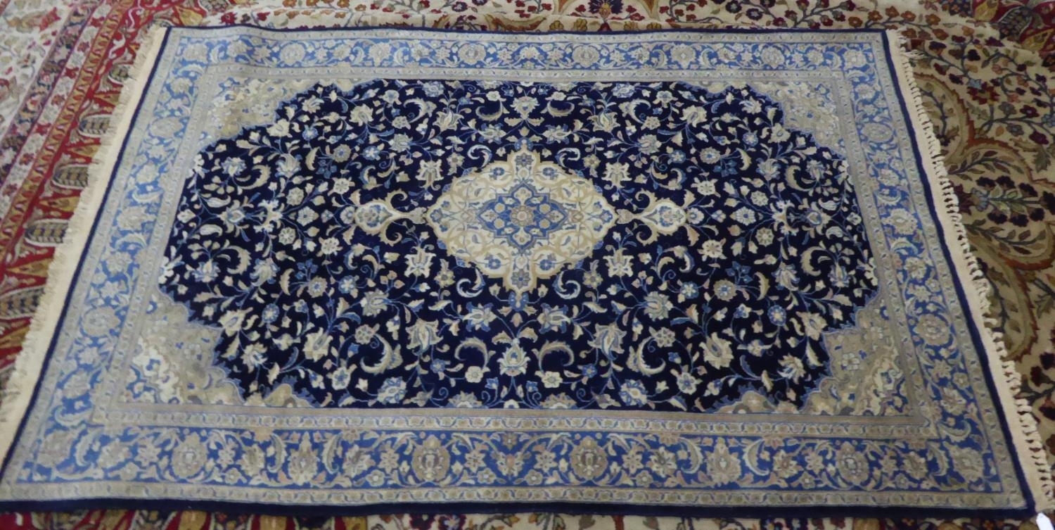 KERMAN, PERSIAN RUG, with centre medallion lozenge shaped with pendant in off-white and pale blue on