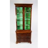 MODERN YEW WOOD SMALL LIBRARY BOOKCASE, the dentil moulded cornice above a pair of thirteen panel