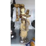 TWO PAINTED AND GILT COMPOSITION TORCHERES, ONE IN THE FORM OF WINGED ANGEL, 16in (40.7cm) HIGH, THE