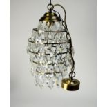 GILT METAL AND CUT GLASS LANTERN PATTERN LIGHT SHADE, with six graduated tiers, each pendant with