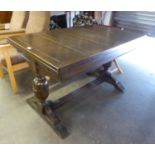 AN OAK DRAW LEAF DINING TABLE