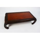 EARLY TWENTIETH CENTURY CHINESE CARVED HARDWOOD LOW OCCASIONAL TABLE, the rectangular top with