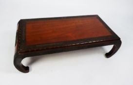 EARLY TWENTIETH CENTURY CHINESE CARVED HARDWOOD LOW OCCASIONAL TABLE, the rectangular top with