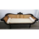 FINE 19th CENTURY ANGLO INDIAN EBONISED DOUBLE SCROLL ENDED SOFA, the reeded frame set with cane