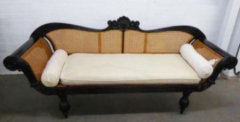 FINE 19th CENTURY ANGLO INDIAN EBONISED DOUBLE SCROLL ENDED SOFA, the reeded frame set with cane