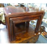 A NEST OF THREE ROSEWOOD OBLONG COFFEE TABLES, ON STRAIGHT LEGS