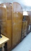 AN OAK SINGLE DOOR HANG WARDROBE AND AN OAK MILLINERY CABINET WITH TWO DOORS OVER THREE DRAWERS