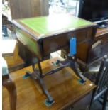 A MAHOGANY COFFEE TABLE, IN THE FORM OF A REGENCY SOFA TABLE, WITH INLET LEATHER TOP