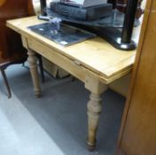 STRESSED PINE OBLONG KITCHEN TABLE ON TURNED LEGS, HAVING FOLD-OVER TOP