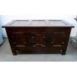 ANTIQUE OAK COFFER, the triple panelled top above a conforming front with geometric mouldings, and