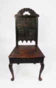 ANTIQUE CARVED OAK SIDE CHAIR, the panelled back carved with serpents and stylised foliage, and