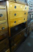 A MEDIUM OAK CHEST OF THREE GRADUATED LONG DRAWERS; AN OAK DRESSING CHEST WITH THREE LONG DRAWERS