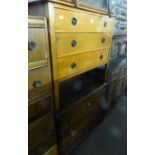 A MEDIUM OAK CHEST OF THREE GRADUATED LONG DRAWERS; AN OAK DRESSING CHEST WITH THREE LONG DRAWERS